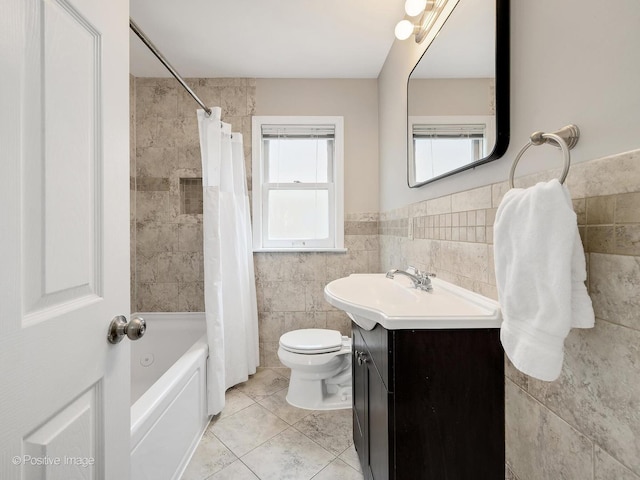 610 S Madison Ave, La Grange, IL 60525 - full bathroom with vanity, tile walls, tile patterned floors, shower / tub combo with curtain, and a wainscoted wall