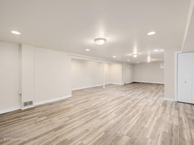 610 S Madison Ave, La Grange, IL 60525 - finished below grade area with light wood finished floors and recessed lighting