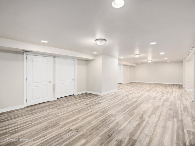 610 S Madison Ave, La Grange, IL 60525 - finished below grade area featuring recessed lighting and light wood-style floors