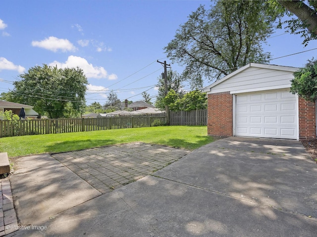 610 S Madison Ave, La Grange, IL 60525 - view of patio featuring an outdoor structure, a detached garage, and driveway