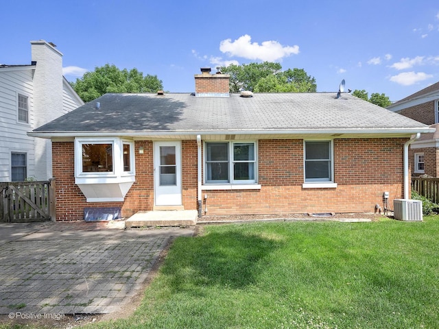610 S Madison Ave, La Grange, IL 60525 - view of front of house with brick siding, a chimney, and roof with shingles
