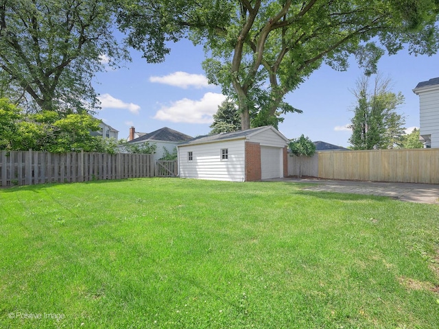 610 S Madison Ave, La Grange, IL 60525 - fenced backyard with a garage and an outbuilding
