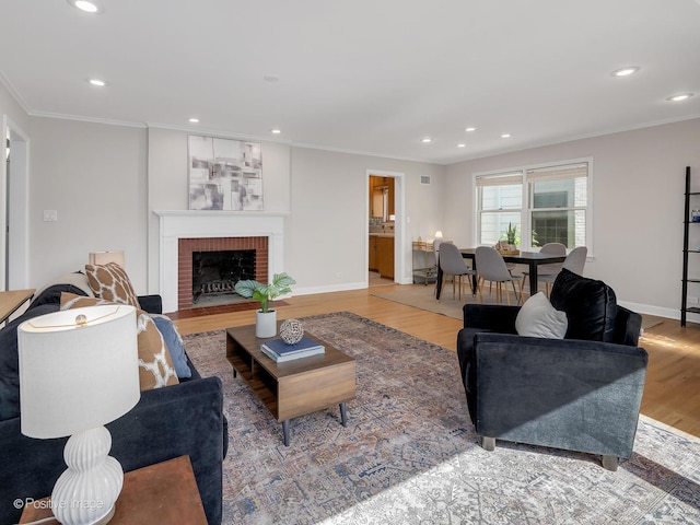 610 S Madison Ave, La Grange, IL 60525 - living room featuring crown molding, wood finished floors, recessed lighting, and a brick fireplace