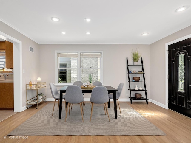 610 S Madison Ave, La Grange, IL 60525 - dining space with crown molding, light wood-style flooring, and recessed lighting