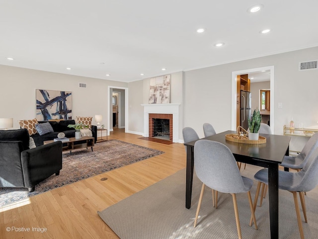610 S Madison Ave, La Grange, IL 60525 - dining area with light wood-type flooring, a fireplace, and recessed lighting