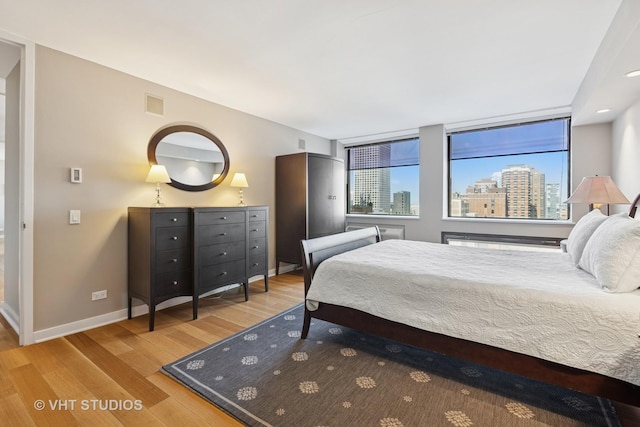 1110 N Lake Shore Dr Unit 20N, Chicago, IL 60611 - bedroom with wood finished floors and a city view