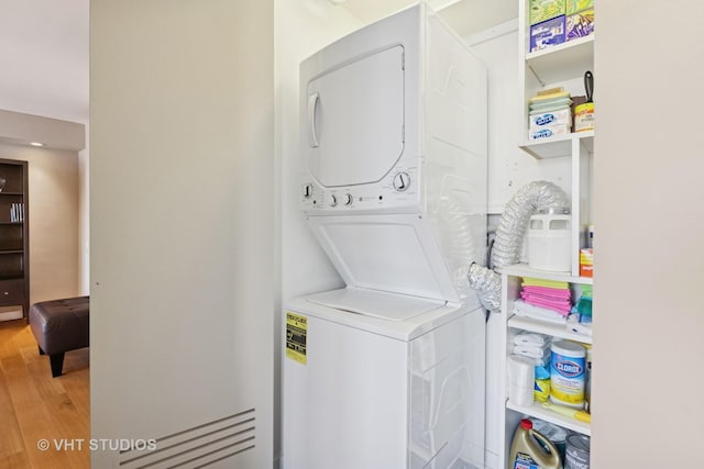1110 N Lake Shore Dr Unit 20N, Chicago, IL 60611 - laundry area with stacked washer and clothes dryer and wood finished floors