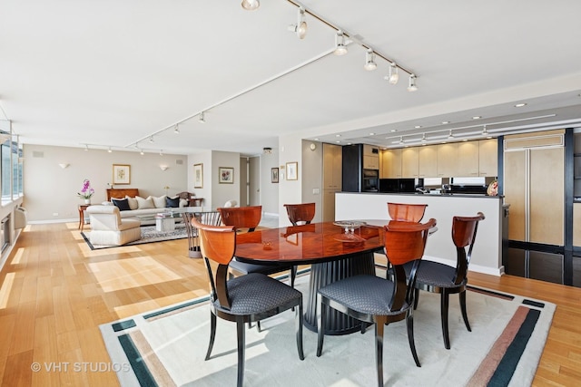 1110 N Lake Shore Dr Unit 20N, Chicago, IL 60611 - dining area featuring track lighting and light wood-type flooring