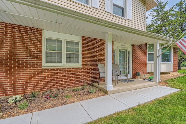 1322 E Thurston Dr, Palatine, IL 60074 - doorway to property featuring a porch and brick siding
