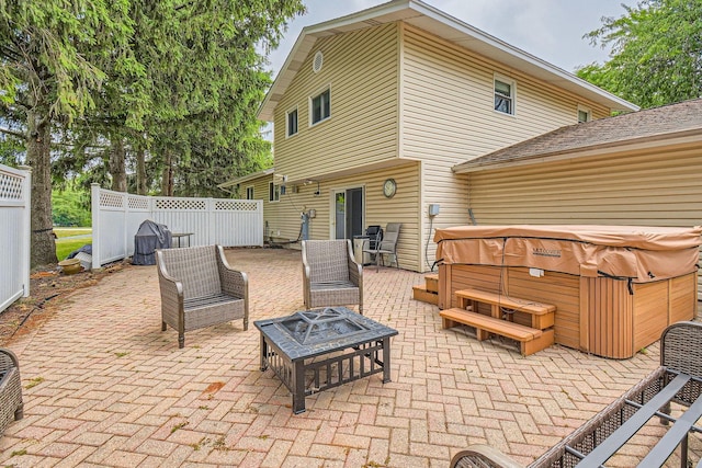 1322 E Thurston Dr, Palatine, IL 60074 - view of patio / terrace with a hot tub and an outdoor fire pit