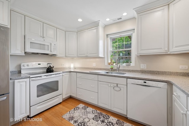 1503 Oak Ave Unit 312, Evanston, IL 60201 - kitchen featuring white appliances, white cabinets, light wood finished floors, light countertops, and recessed lighting