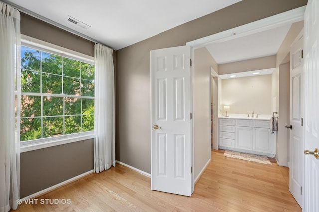 1503 Oak Ave Unit 312, Evanston, IL 60201 - unfurnished bedroom with light wood-style floors and ensuite bath
