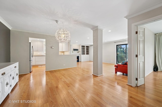 1503 Oak Ave Unit 312, Evanston, IL 60201 - unfurnished living room with a chandelier, light wood finished floors, ornate columns, recessed lighting, and ornamental molding