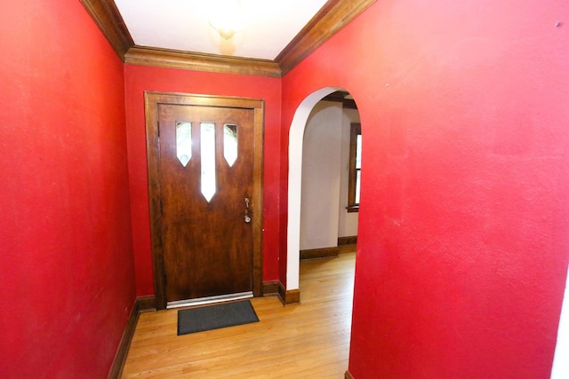 314 N Maple St, Itasca, IL 60143 - foyer entrance featuring crown molding, arched walkways, and light wood-style flooring