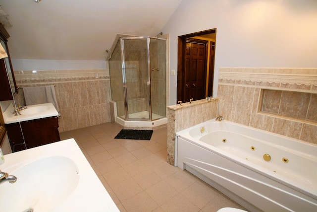 314 N Maple St, Itasca, IL 60143 - bathroom featuring lofted ceiling, tile walls, vanity, a shower stall, and a jetted tub