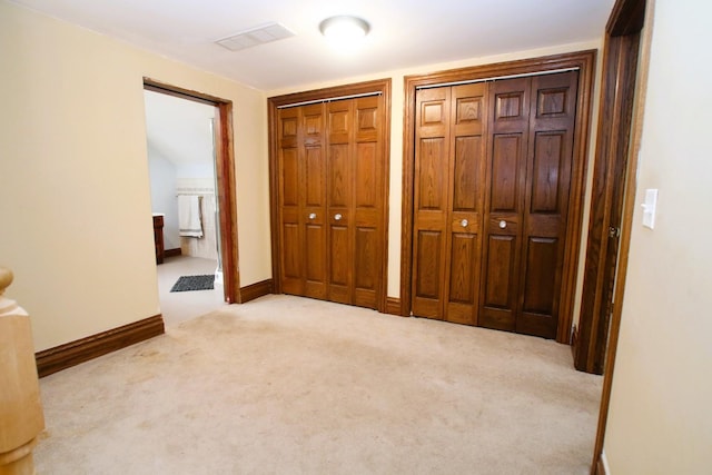 314 N Maple St, Itasca, IL 60143 - unfurnished bedroom with multiple closets, carpet, and ensuite bathroom