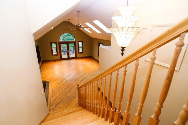 314 N Maple St, Itasca, IL 60143 - stairs featuring wood finished floors, a skylight, high vaulted ceiling, and a chandelier