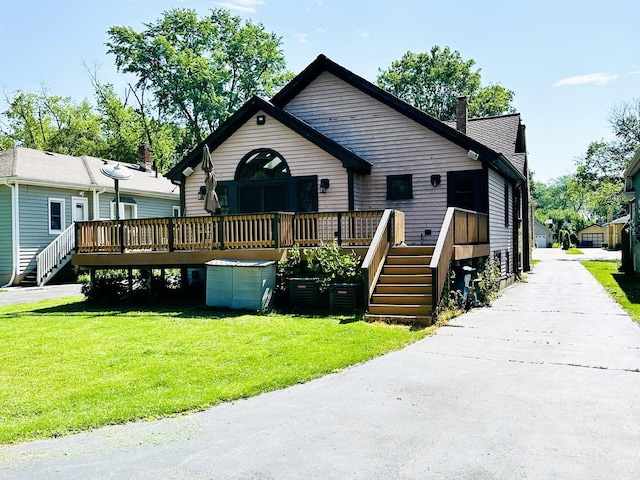 314 N Maple St, Itasca, IL 60143 - rear view of house featuring a wooden deck, a lawn, and stairs