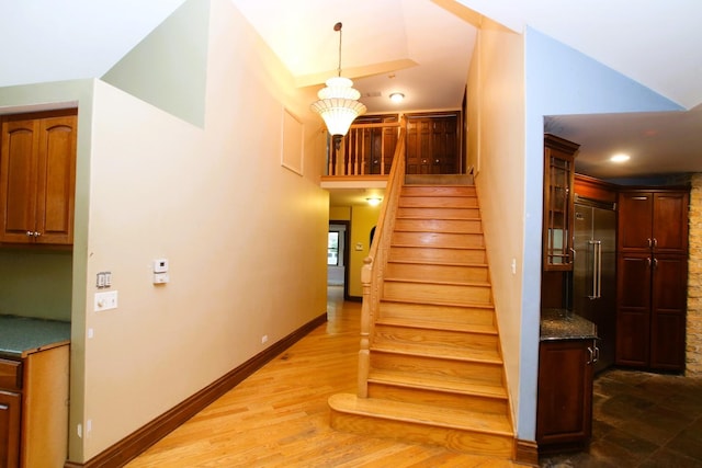 314 N Maple St, Itasca, IL 60143 - staircase with a high ceiling and wood finished floors