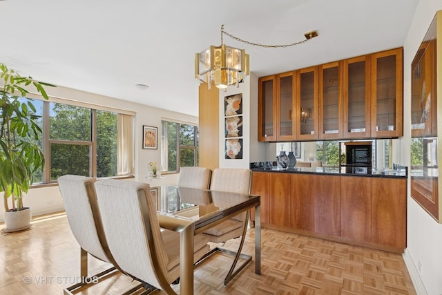 2970 N Lake Shore Dr Unit 7B-7C, Chicago, IL 60657 - dining space with a chandelier and baseboards