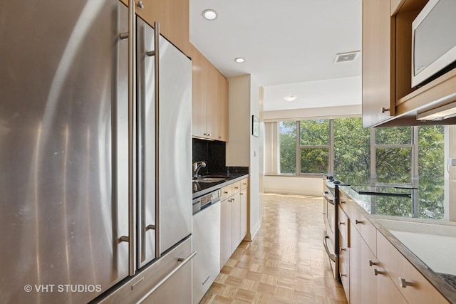 2970 N Lake Shore Dr Unit 7B-7C, Chicago, IL 60657 - kitchen featuring appliances with stainless steel finishes, recessed lighting, and decorative backsplash