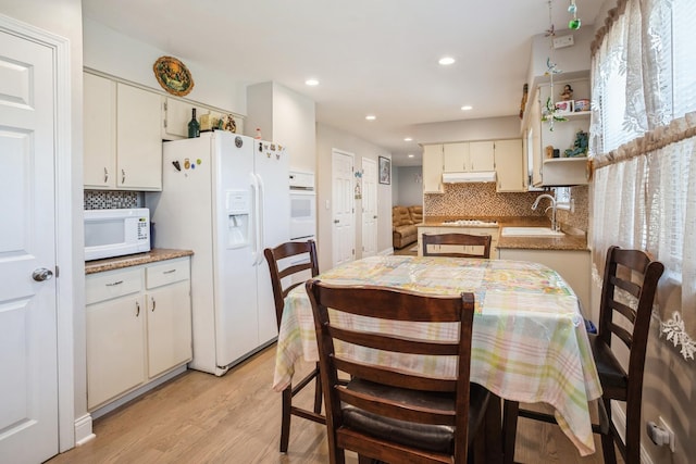 1109 S Lavergne Dr, Mount Prospect, IL 60056 - dining room featuring light wood-style flooring and recessed lighting