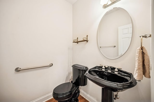 775 S Camelot Ct, Lake Forest, IL 60045 - half bathroom with baseboards and wood finished floors