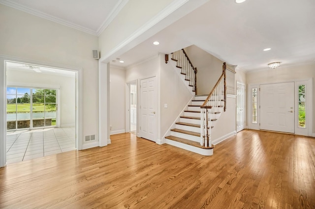 775 S Camelot Ct, Lake Forest, IL 60045 - entryway with stairs, crown molding, light wood-type flooring, recessed lighting, and a ceiling fan