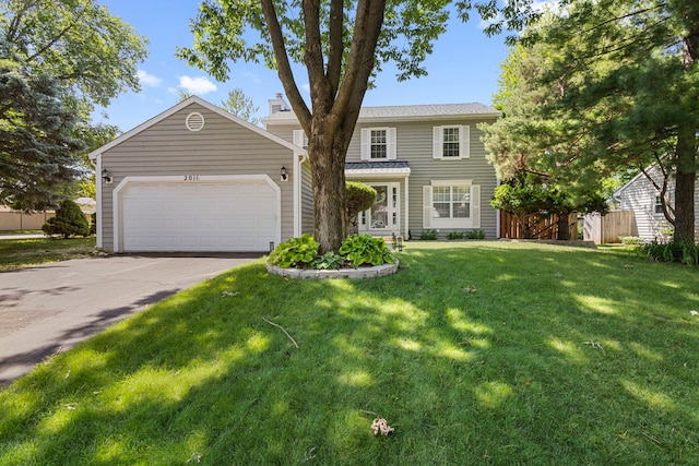 2011 University Dr, Naperville, IL 60565 - view of front of house featuring an attached garage, concrete driveway, and a chimney