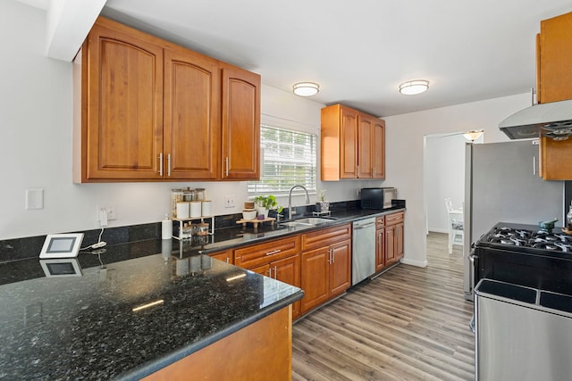 2011 University Dr, Naperville, IL 60565 - kitchen featuring stainless steel appliances, light wood-style flooring, and brown cabinetry