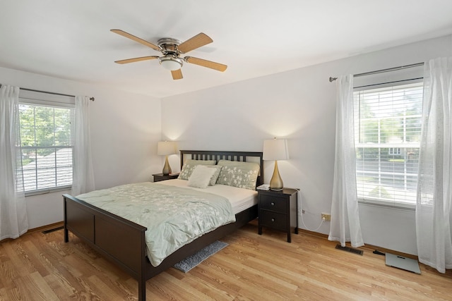 2011 University Dr, Naperville, IL 60565 - bedroom with light wood-style flooring and ceiling fan