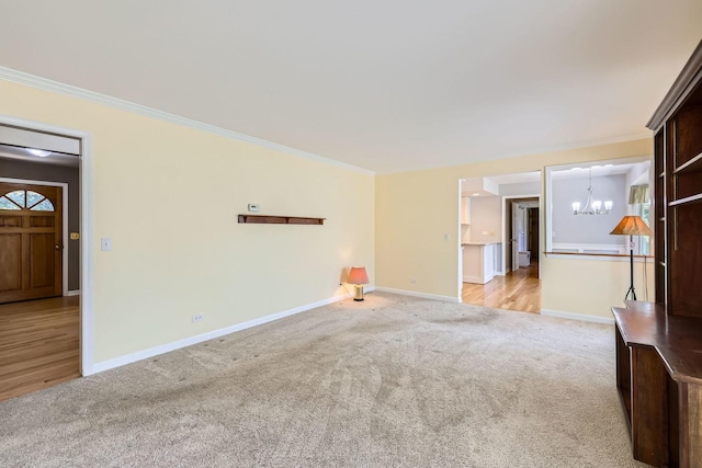 201 S Wulff St, Cary, IL 60013 - carpeted empty room featuring a chandelier and crown molding