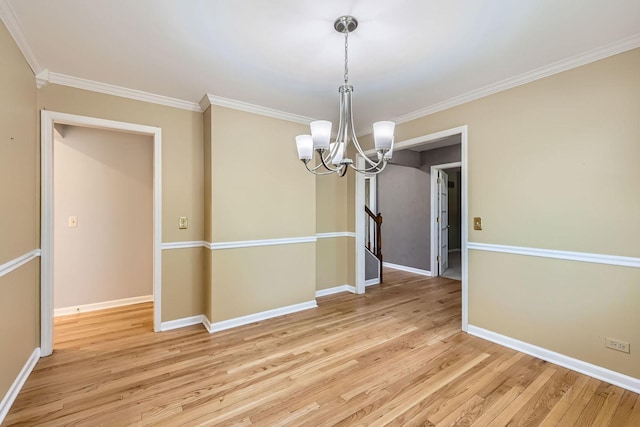 201 S Wulff St, Cary, IL 60013 - unfurnished room featuring a chandelier, light wood-style floors, and crown molding