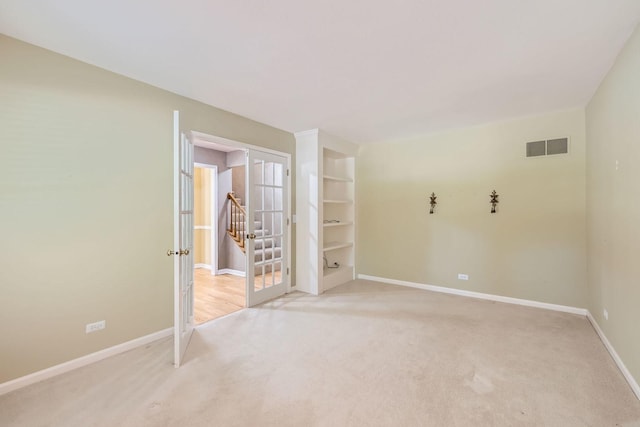 201 S Wulff St, Cary, IL 60013 - empty room with light colored carpet and french doors