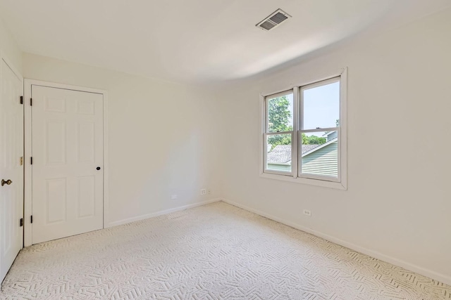 201 S Wulff St, Cary, IL 60013 - spare room featuring light colored carpet and baseboards