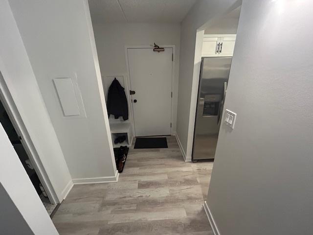 9098 Terrace Dr Unit 3E, Niles, IL 60714 - corridor with light wood-type flooring and baseboards