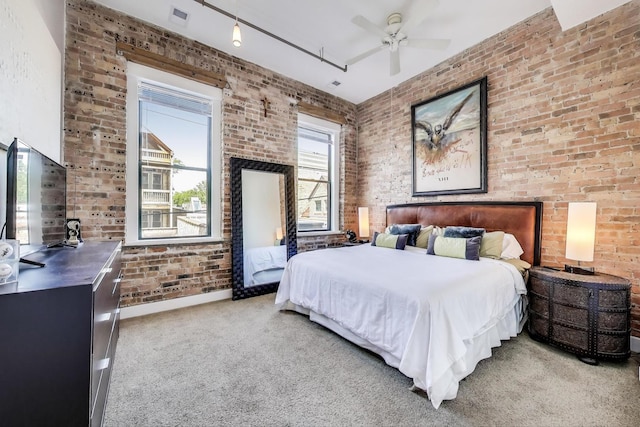 2035 W Charleston St Unit 205, Chicago, IL 60647 - bedroom featuring light colored carpet, brick wall, and a ceiling fan