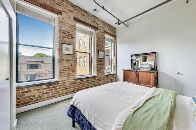 2035 W Charleston St Unit 205, Chicago, IL 60647 - bedroom featuring brick wall, carpet floors, and baseboard heating