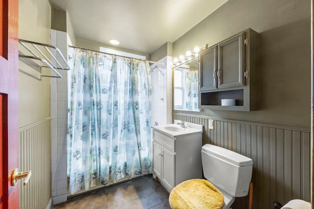 1318 S 61st Ct, Cicero, IL 60804 - bathroom with vanity, wainscoting, and shower / bathtub combination with curtain