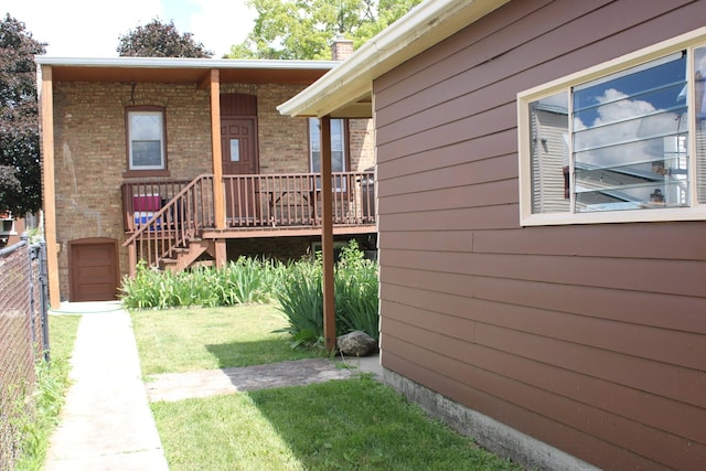 1318 S 61st Ct, Cicero, IL 60804 - view of front facade featuring brick siding, a front lawn, and a chimney