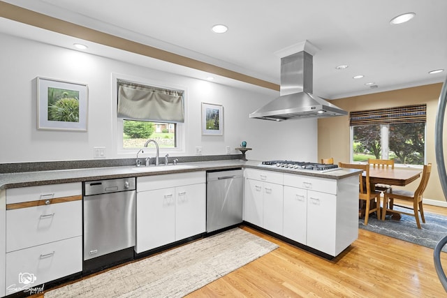 1886 N Springview Dr, Kankakee, IL 60901 - kitchen with island range hood, stainless steel appliances, white cabinetry, light wood-style flooring, and recessed lighting