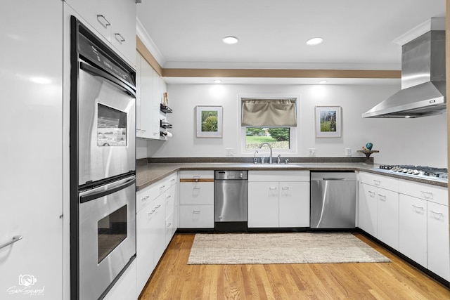 1886 N Springview Dr, Kankakee, IL 60901 - kitchen with stainless steel appliances, wall chimney range hood, white cabinetry, dark countertops, and crown molding