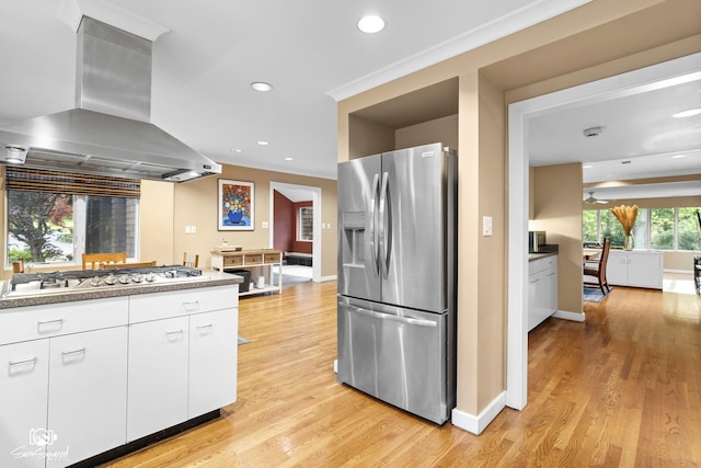 1886 N Springview Dr, Kankakee, IL 60901 - kitchen featuring appliances with stainless steel finishes, extractor fan, white cabinets, light wood-style flooring, and recessed lighting