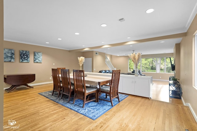 1886 N Springview Dr, Kankakee, IL 60901 - dining room with light wood finished floors, crown molding, recessed lighting, and stairway