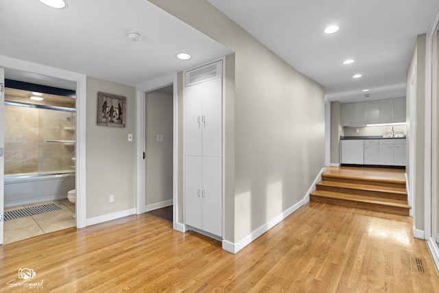 1886 N Springview Dr, Kankakee, IL 60901 - hallway featuring light wood finished floors, recessed lighting, and stairway