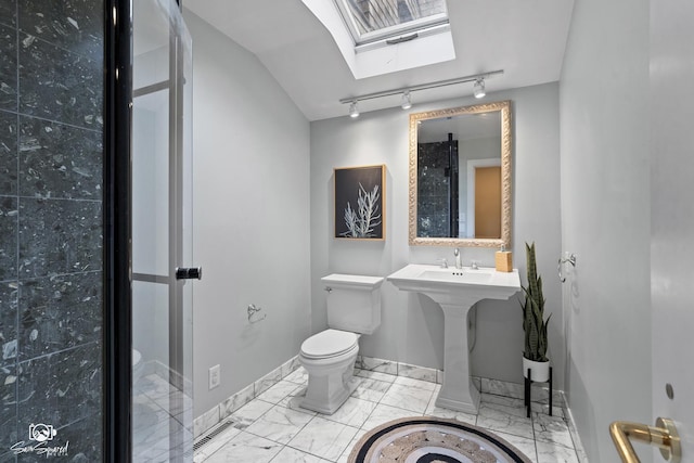 1886 N Springview Dr, Kankakee, IL 60901 - bathroom with marble finish floors, track lighting, and a skylight