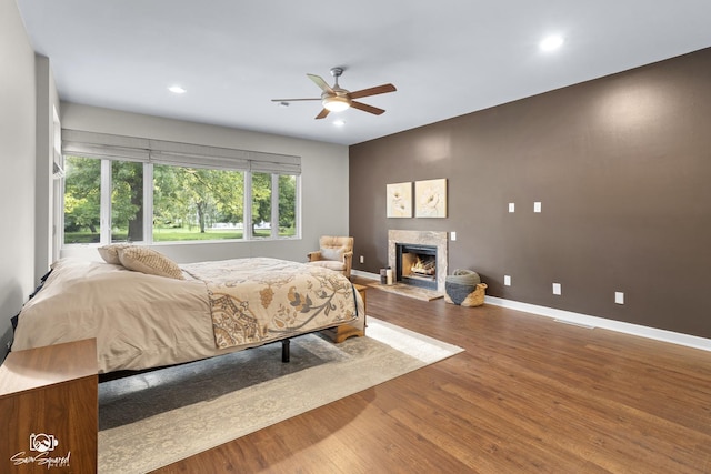 1886 N Springview Dr, Kankakee, IL 60901 - bedroom featuring wood finished floors, recessed lighting, a fireplace, and a ceiling fan