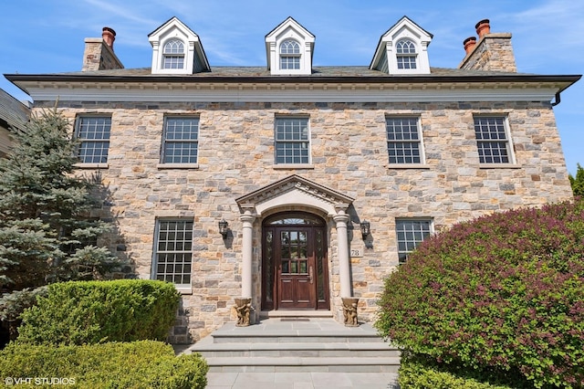 78 Wagner Rd, Northfield, IL 60093 - view of front facade with stone siding and a chimney