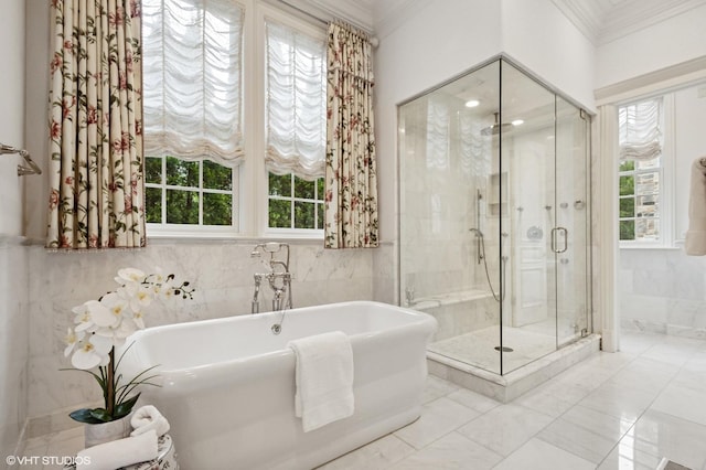 78 Wagner Rd, Northfield, IL 60093 - bathroom featuring a freestanding bath, a shower stall, ornamental molding, marble look tile flooring, and tile walls