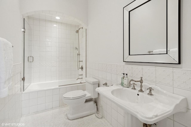 78 Wagner Rd, Northfield, IL 60093 - full bathroom with tiled shower / bath, tile patterned flooring, tile walls, and wainscoting